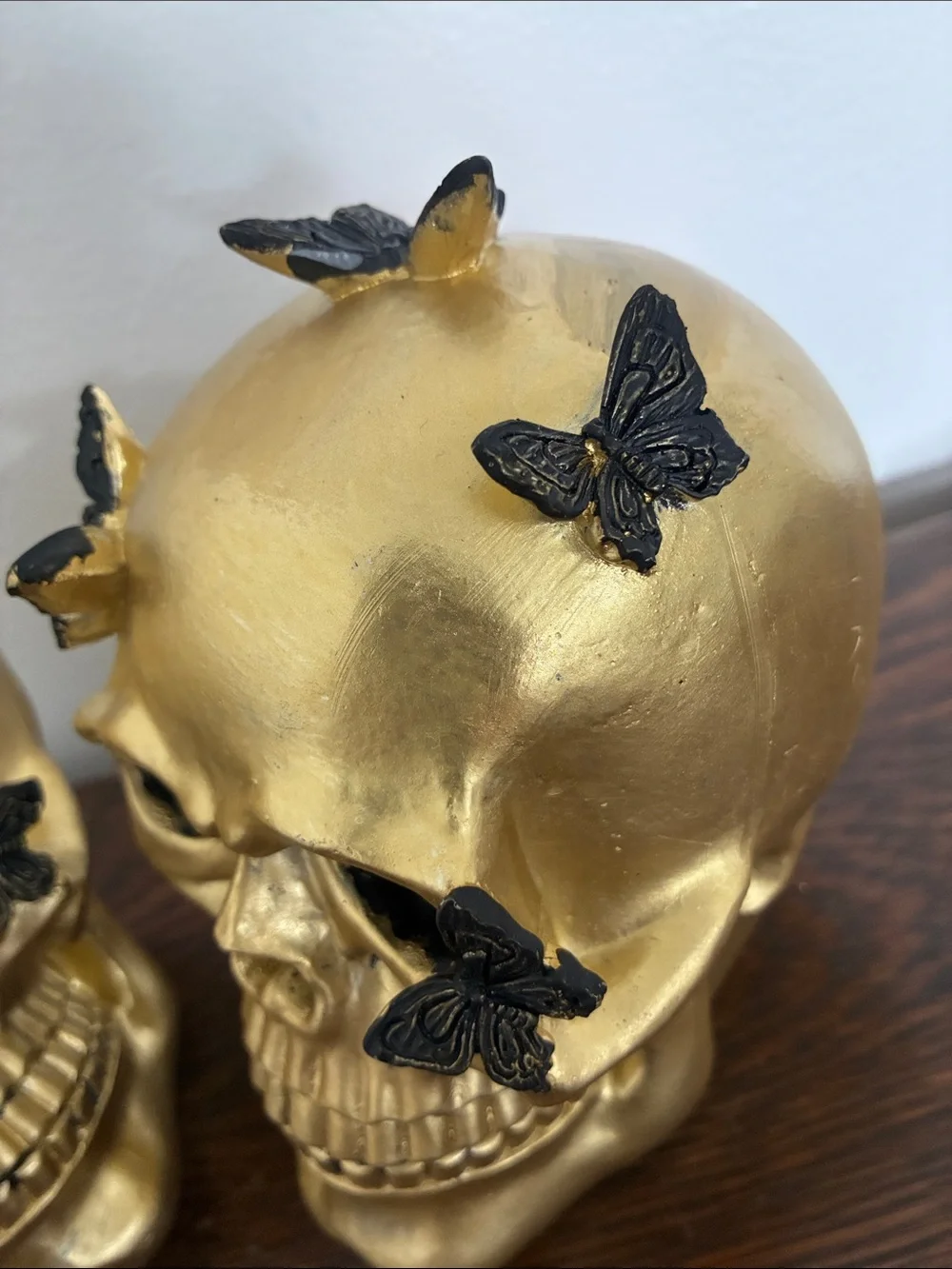 NWT- Set of 2- STUNNING- Gold Skull Statues with Black Butterflies Accents